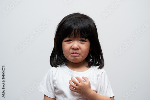 Canvastavla Portrait of Asian angry, sad and cry little girl on white isolated background, The emotion of a child when tantrum and mad, expression grumpy emotion