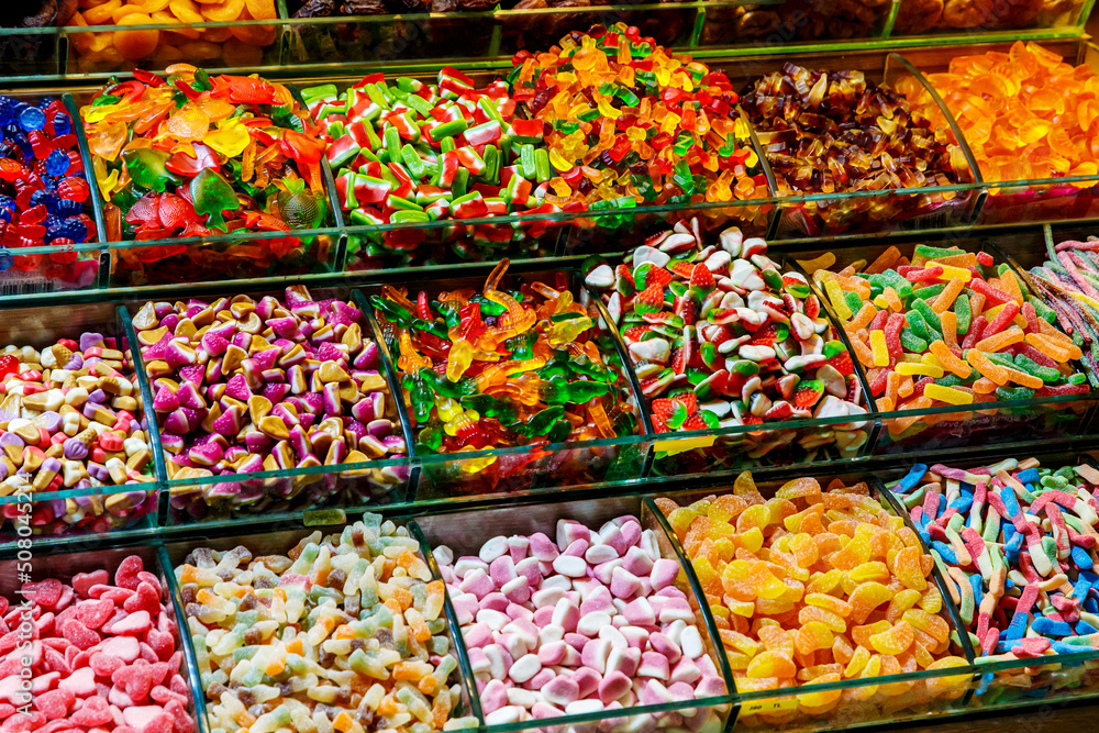 Close-up of colorful sweets and jellies at a market stall.Various gelatin. Close-up of colorful sweets and jellies at a market stall.Various gelatin.