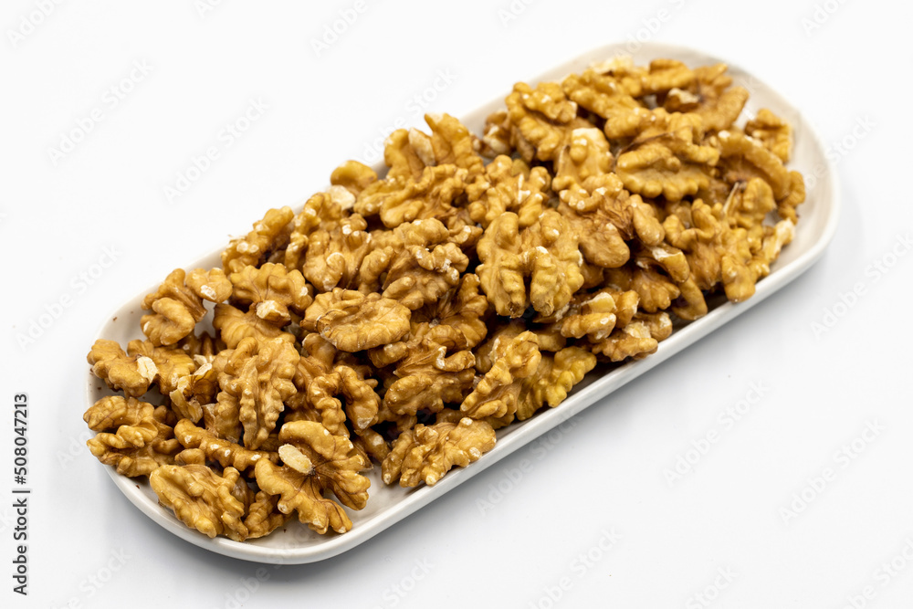 Walnut on white background. Close-up walnut kernel Walnut on white background. Close-up walnut kernel