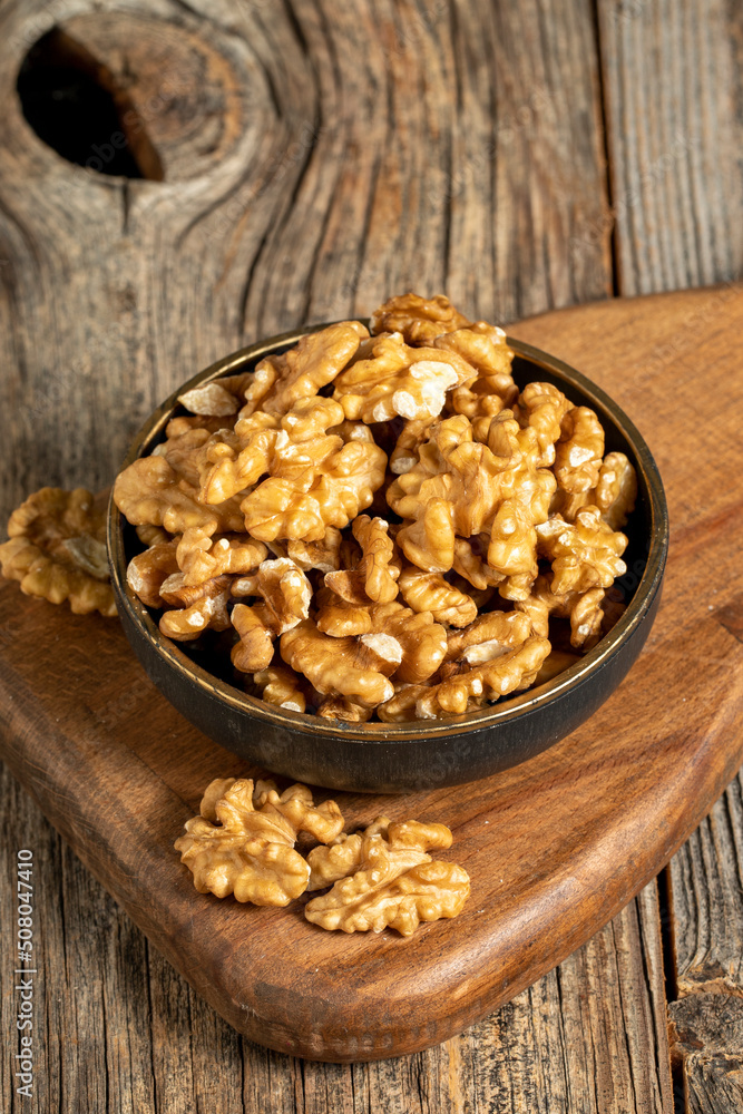 Walnut on wooden background. Close-up walnut kernel Walnut on wooden background. Close-up walnut kernel