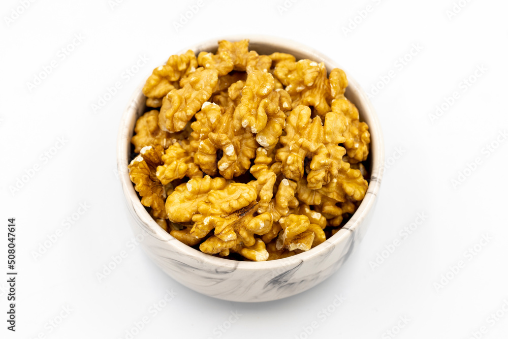 Walnut on white background. Close-up walnut kernel