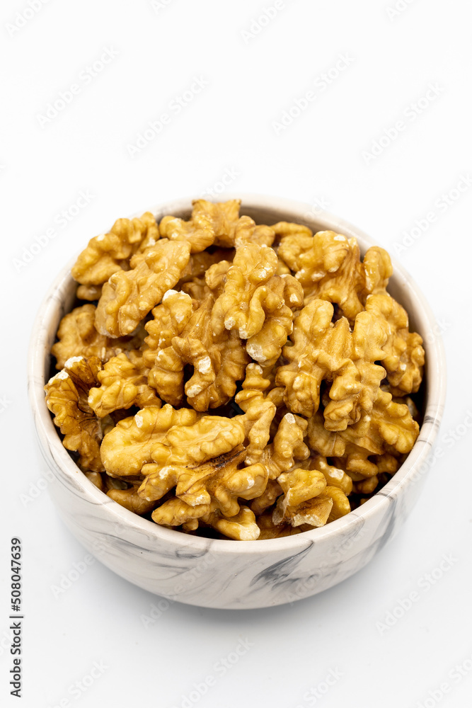 Walnut on white background. Close-up walnut kernel Walnut on white background. Close-up walnut kernel