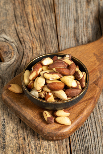Brazil walnut on wooden background. Close-up brazil walnut kernel