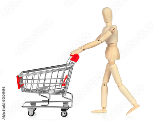 Wooden Manikin with shopping cart, shopping concept on white background © rvlsoft