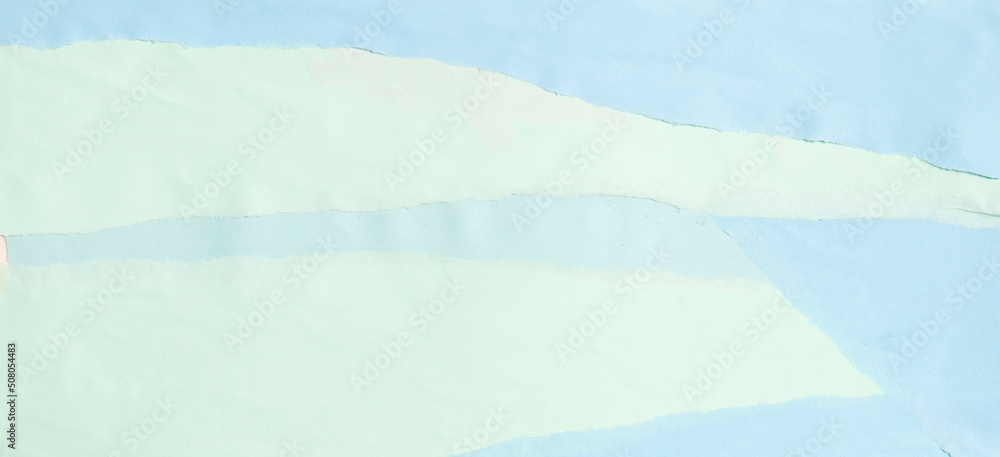 Torn grunge ripped pastel green and light blue color paper banner background Torn grunge ripped pastel green and light blue color paper banner background