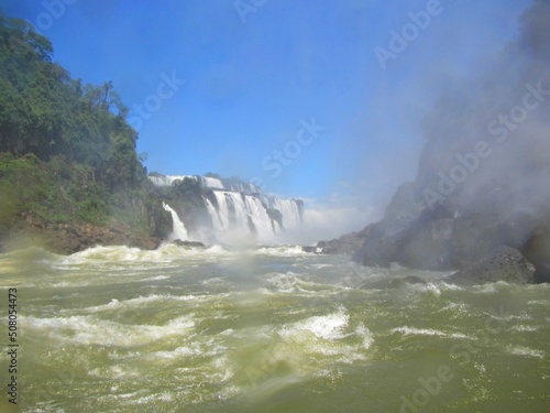 Принти на полотні In the middle of the Iguaçu waterfalls, wet and misty in the air