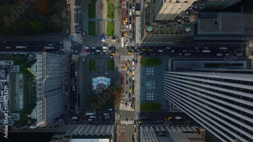 Aerial birds eye overhead top down panning view of busy streets at Pulitzer and Grand Army Plaza. Manhattan, New York City, USA photo