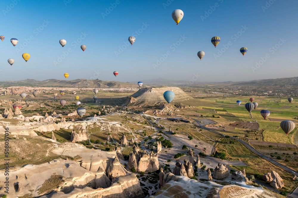 hot air balloon against blue sky above Cappadocia