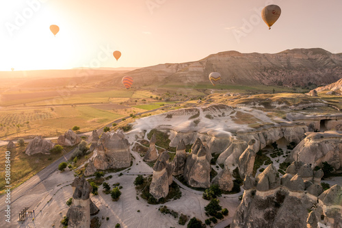 hot air balloons in the morning sky above Cappadocia at sunrise