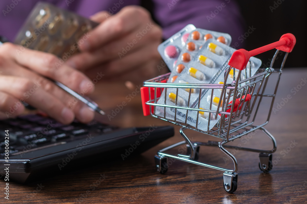 Concept of large spending on medicines. Shopping cart full of medicines and pills. Concept of large spending on medicines. Shopping cart full of medicines and pills.