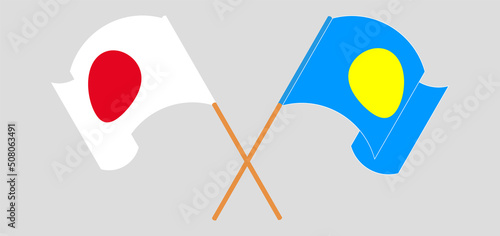 Crossed and waving flags of Japan and Palau