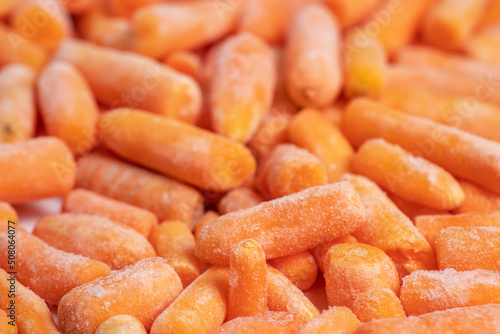 Frozen healthy baby carrots for eating. close up