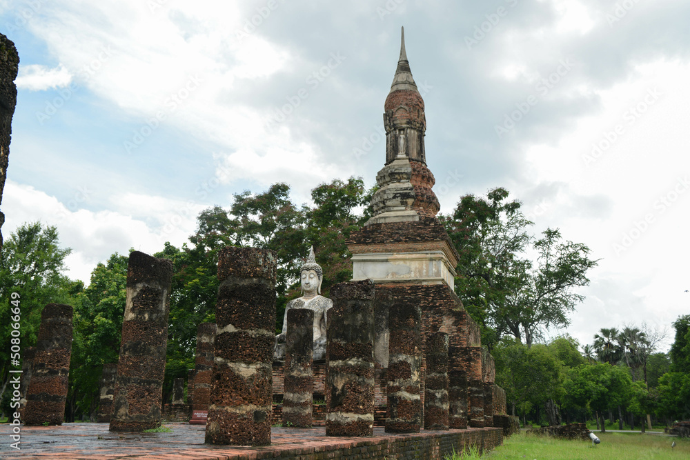 Close-up of Phum Khao Bin Pagoda (the sukhothai pagoda unique) and buddha in old viharn at the Historical Park in Sukhothai. Close-up of Phum Khao Bin Pagoda (the sukhothai pagoda unique) and buddha in old viharn at the Historical Park in Sukhothai.