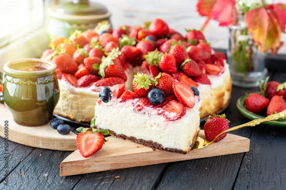 vanilla coconut cheesecake, decorated with fresh strawberries, a cup of aroma coffee on a table	
