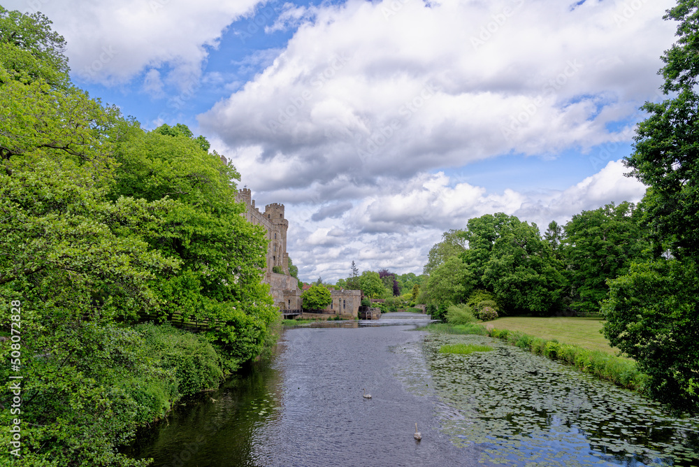 Medieval Warwick Castle and Avon river in Warwickshire - England Medieval Warwick Castle and Avon river in Warwickshire - England