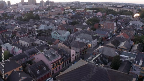 Aerial dolly shot along a French Quarter street in New Orleans at sunset. 4K photo