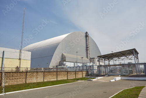 Reactor 4 at the Chernobyl nuclear power plant with a new confinement. Global atomic disaster. Chernobyl Exclusion Zone. © Ryzhkov Oleksandr