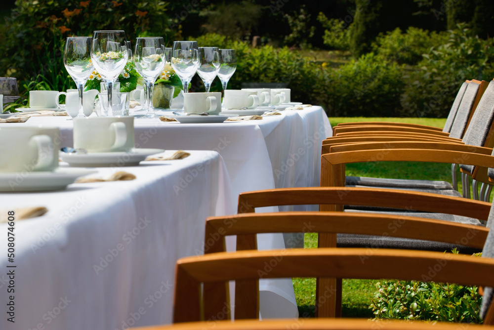 a set table outside in nature. Hotel Restaurant.