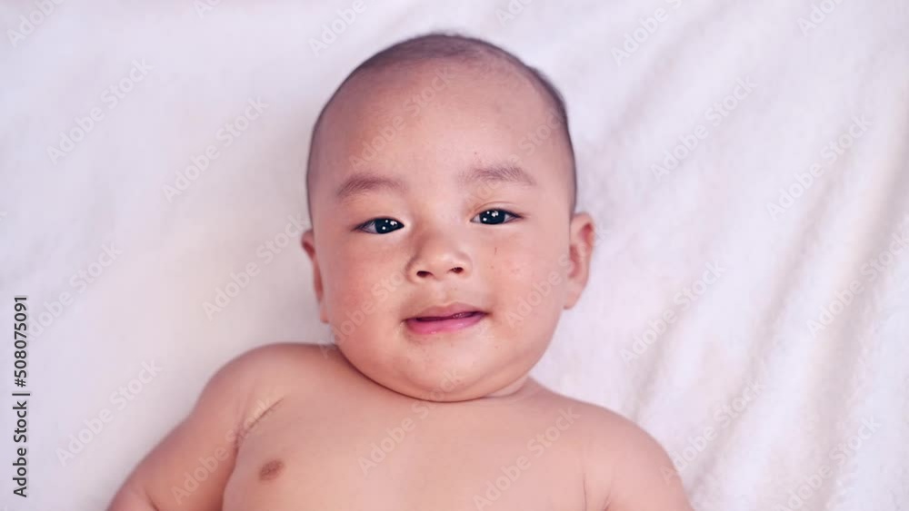 Closeup face baby smile slow motion, kid cute and happy Closeup face baby smile slow motion, kid cute and happy