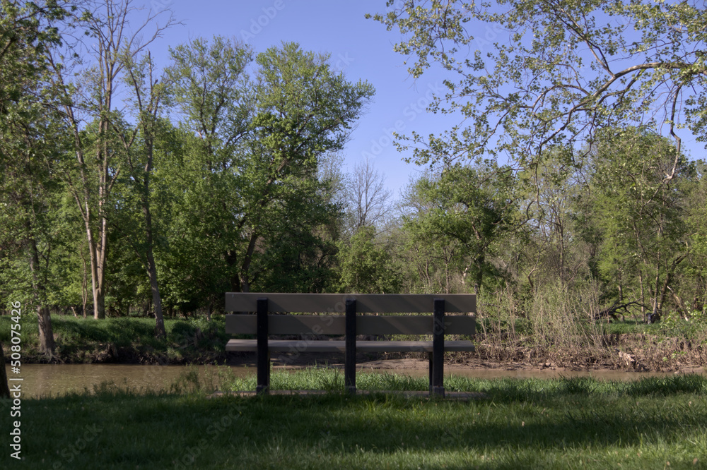 Park bench looking out onto the river Park bench looking out onto the river