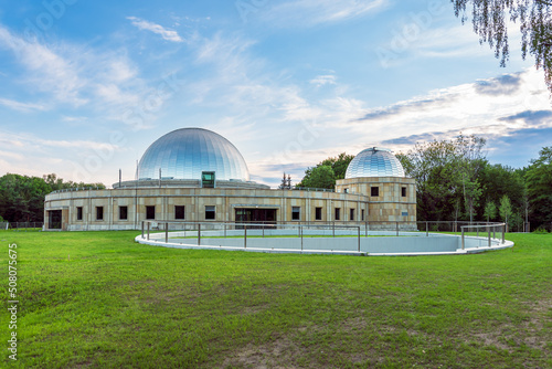 Obraz na płótnie Silesian planetarium after renovation. The dome of the Silesian planetarium shining in the light of the setting sun. Aluminum panels on the roof . w salonie