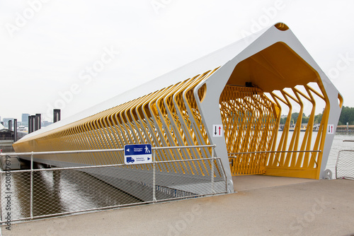 Modern Antwerp cruise terminal  yellow pontoon bridge for mooring river and sea cuise ships. photo