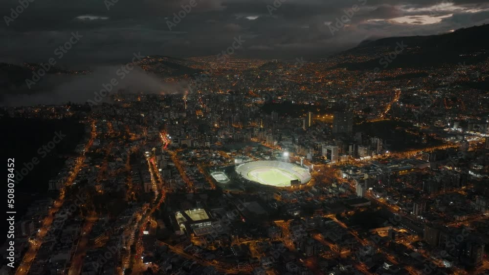 Nighttime drone shot over Quito shows lit up Atahualpa Olympic Stadium Nighttime drone shot over Quito shows lit up Atahualpa Olympic Stadium