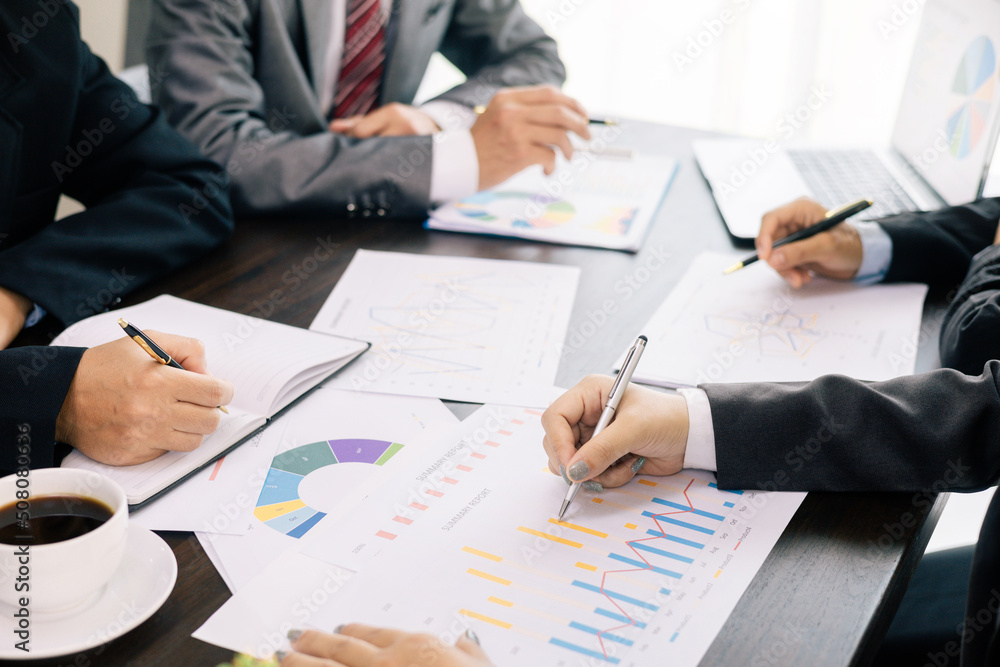 business team Analysis graph to discuss company financial statistics, brainstorm ideas, Teamwork Business Meeting Concept. business team Analysis graph to discuss company financial statistics, brainstorm ideas, Teamwork Business Meeting Concept.