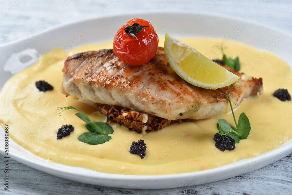 grilled fish fillet with vegetable puree, tomatoes and lemon grilled fish fillet with vegetable puree, tomatoes and lemon
