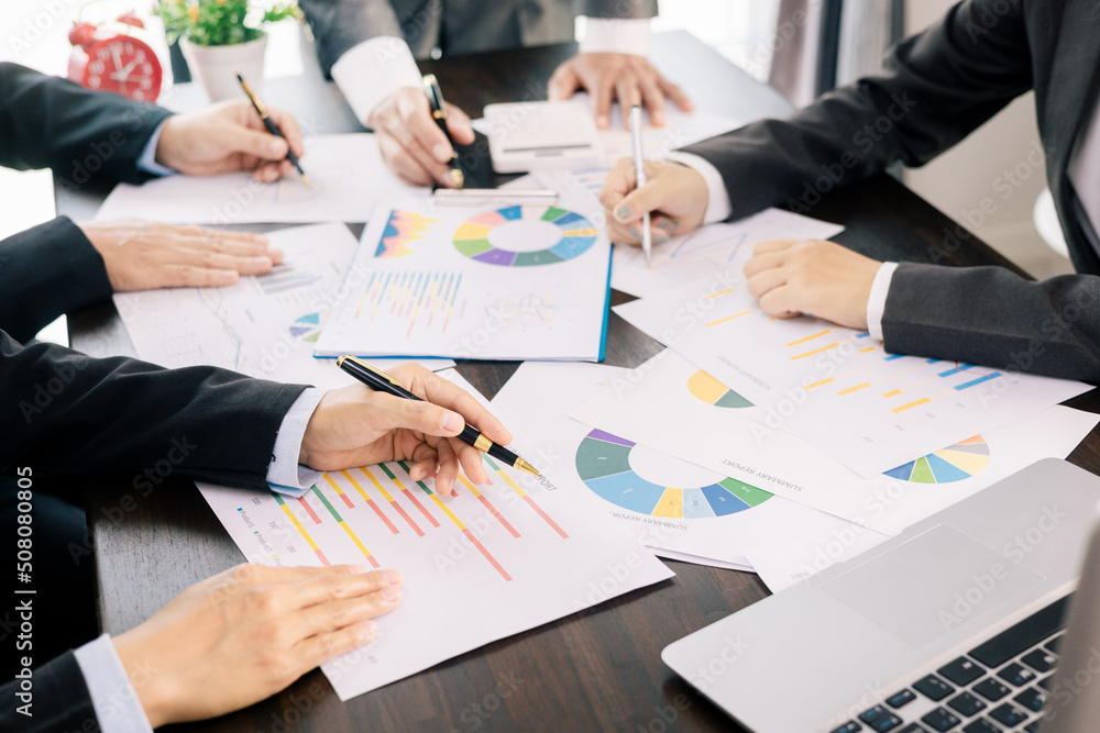 business team Analysis graph to discuss company financial statistics, brainstorm ideas, Teamwork Business Meeting Concept. business team Analysis graph to discuss company financial statistics, brainstorm ideas, Teamwork Business Meeting Concept.