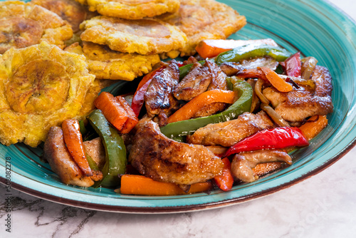 Chopped steak or Bistec Picao and patacones or tostones are fried green plantain slices, made with green plantains, Typical latin food, Panamá, Central America photo