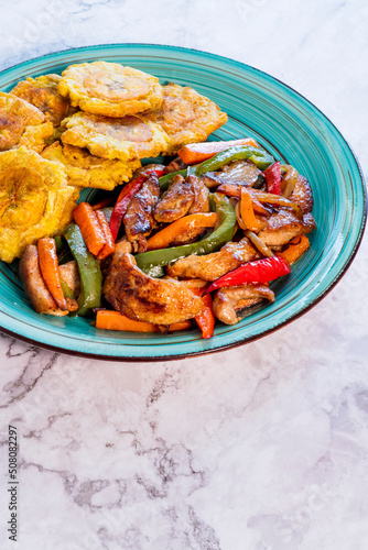 Chopped steak or Bistec Picao and patacones or tostones are fried green plantain slices, made with green plantains, Typical latin food, Panamá, Central America photo