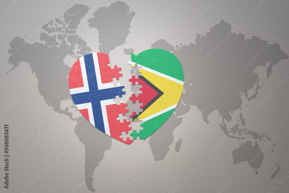 Naklejka premium puzzle heart with the national flag of norway and guyana on a world map background. Concept.