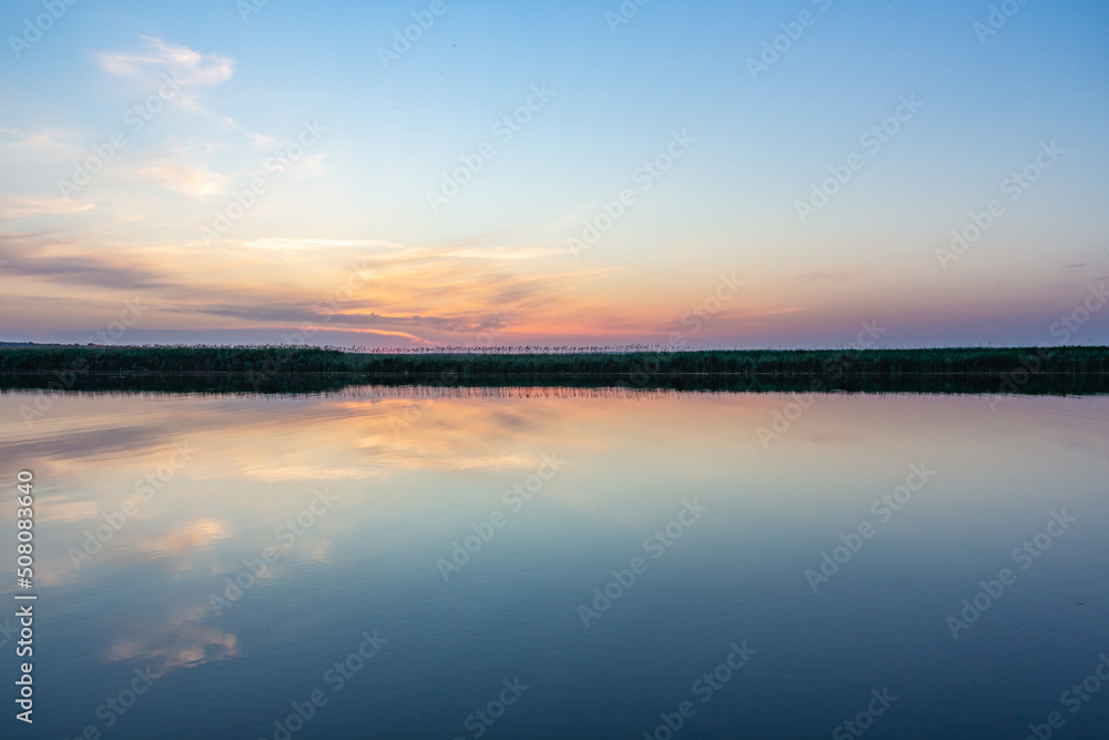 Beautiful sunset on the river, Ukrainian nature, landscape