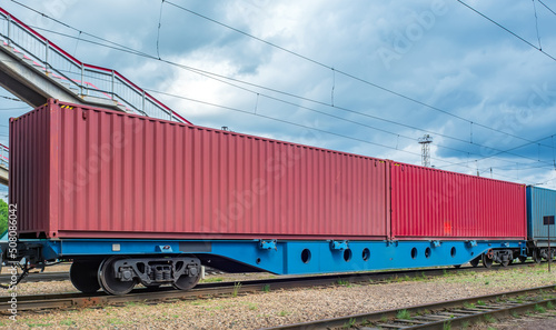 A 80ft flatcar (flat wagon) with two 40ft containers on Trans-Siberian Railroad. Fitting platform.