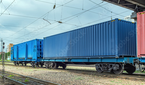 Flatcars (flat wagons) with 40ft containers on Trans-Siberian Railroad. Fitting platforms.