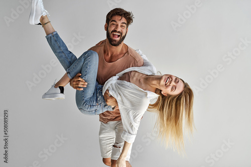 Young sexy couple having fun expressing positive emotions