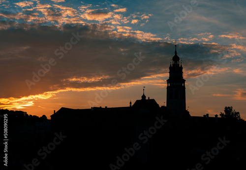 The silhouette of the Cesky Krumlov castle with beautiful colorful sky and clouds during sunset. Český Krumlov, South Bohemia, Czech Republic.