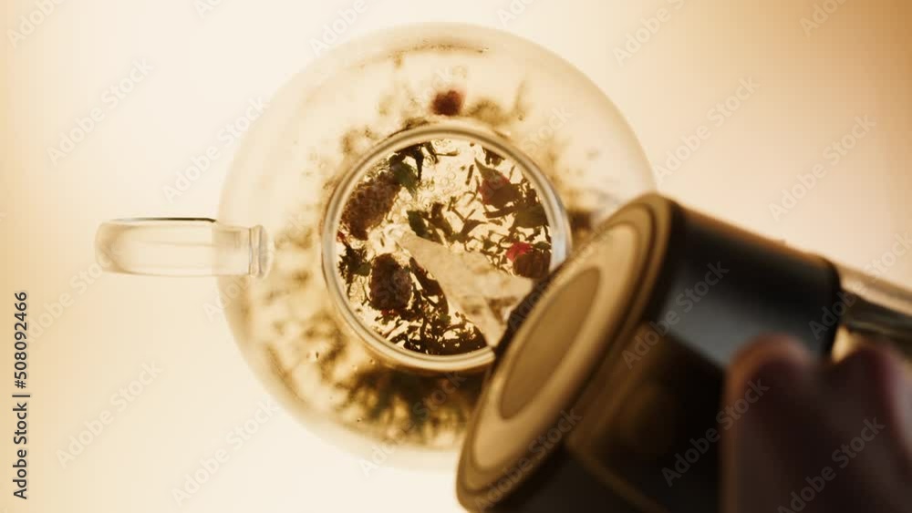 Black tea top view. Fresh hot herbal tea, healthy morning, detox drink on orange background. Black tea top view. Fresh hot herbal tea, healthy morning, detox drink on orange background.