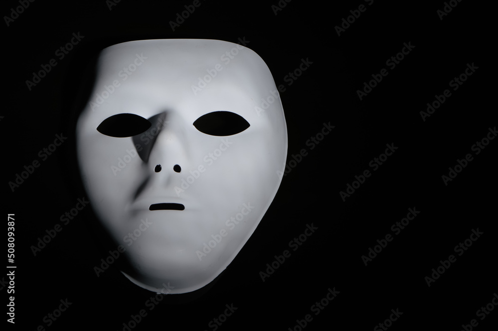 Anonymous mask isolated on a black background Anonymous mask isolated on a black background