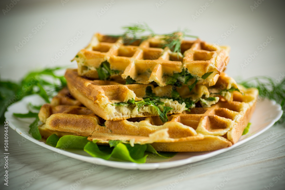 Homemade fried vegetable waffles with herbs inside Homemade fried vegetable waffles with herbs inside