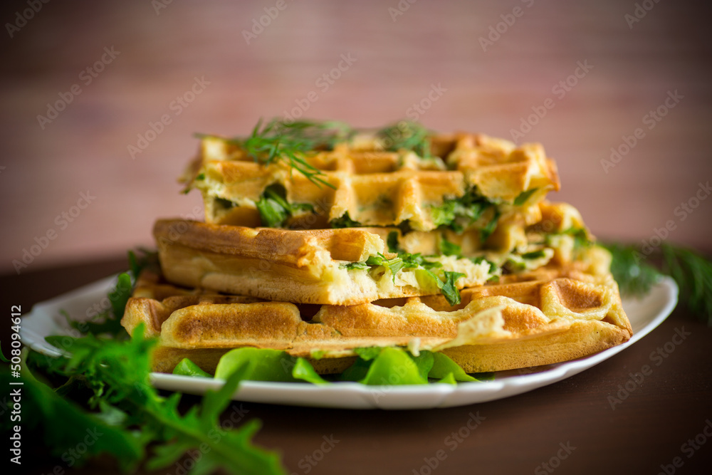 Homemade fried vegetable waffles with herbs inside Homemade fried vegetable waffles with herbs inside