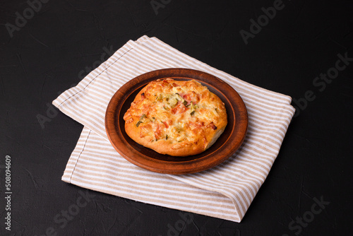 Homemade pizza, pizza on a black background, Georgian cuisine