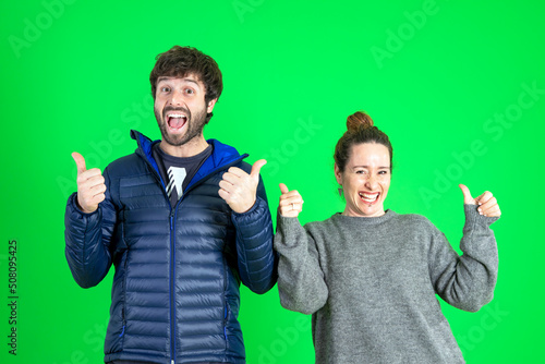 Photo of happy and celebrated man and woman with thumbs up