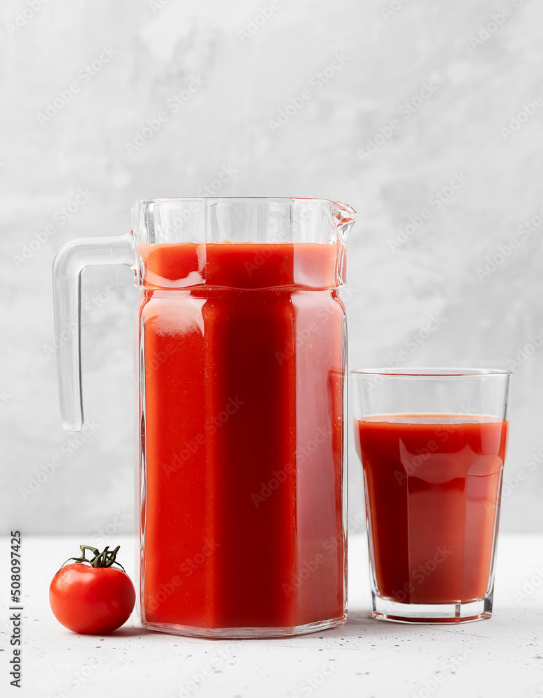tomato juice in jug and tomato tomato juice in jug and tomato