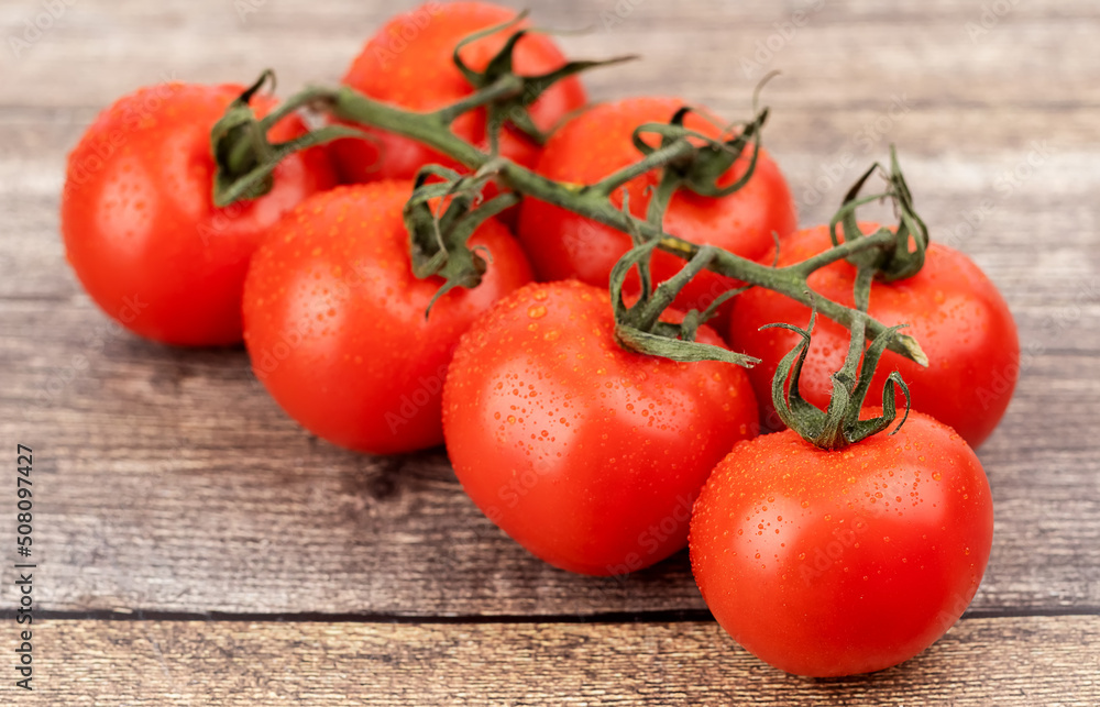 tomatoes on a wooden table tomatoes on a wooden table