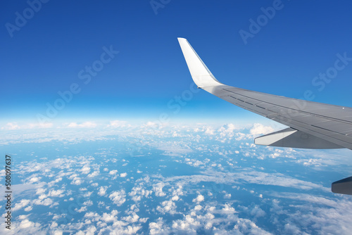 View of the plane wing from the window of passenger seat
