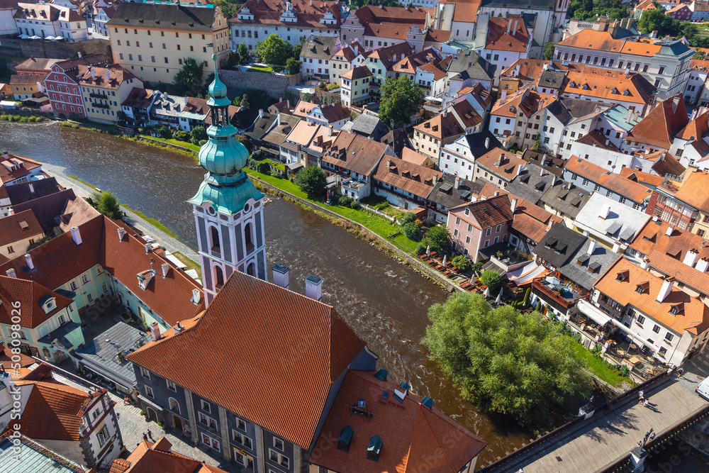 The view of the town of Cesky Krumlov, a church tower and a the Lazebnicky bridge from the Castle tower. Český Krumlov, South Bohemia, Czech Republic.