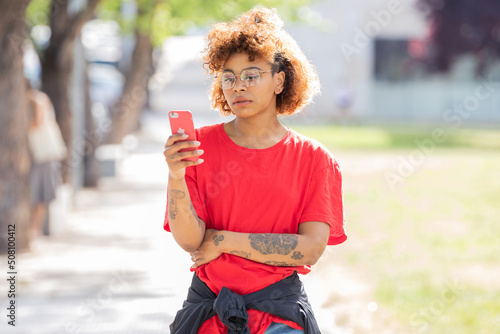 african american girl with mobile phone or smartphone