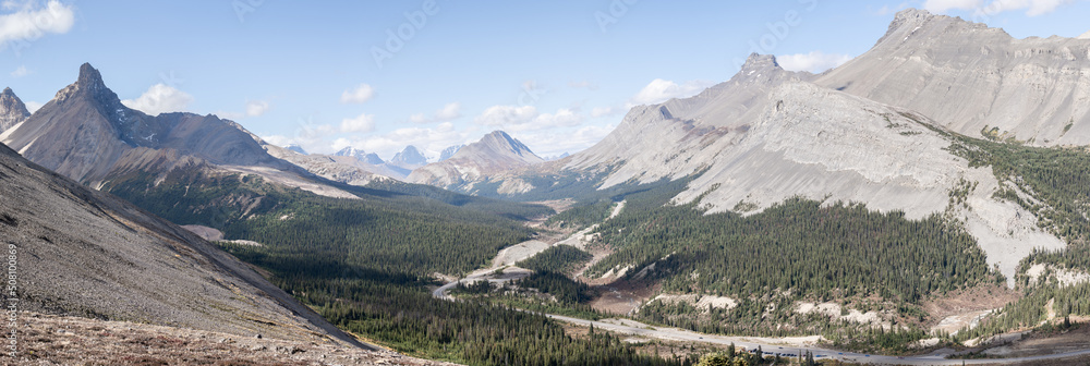 Panoramic view on beautiful alpine valley with highway leading through it, Jasper, Canada